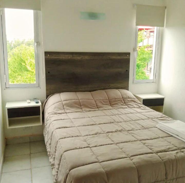 Ένα ή περισσότερα κρεβάτια σε δωμάτιο στο La Cumbre Apartamentos