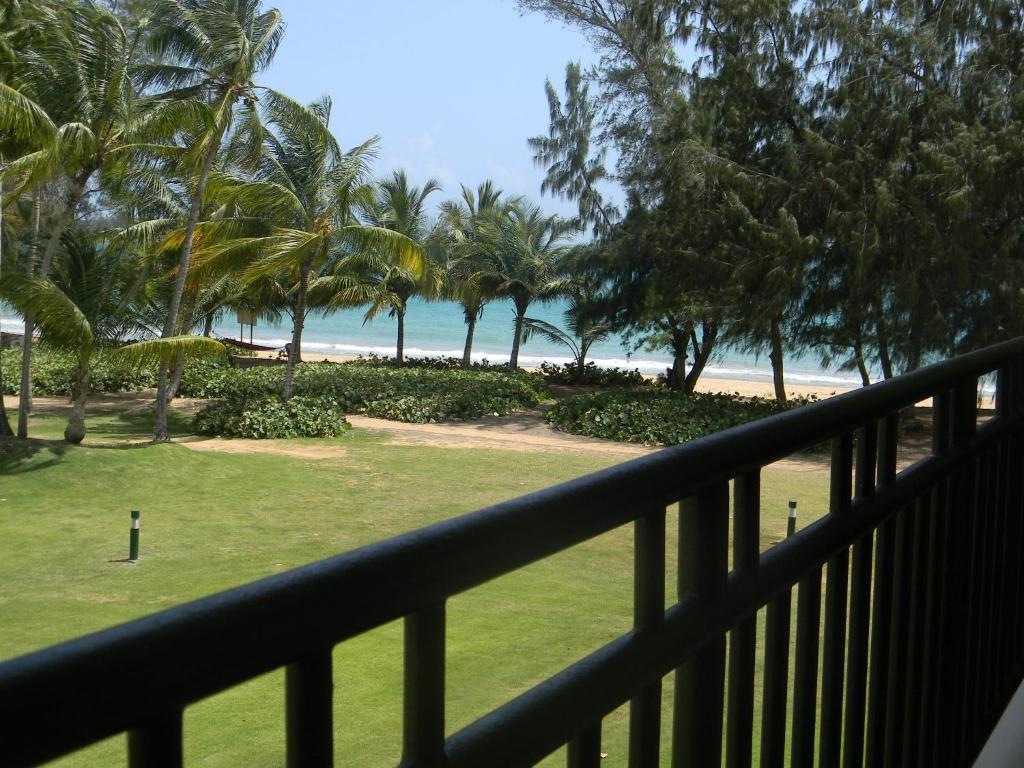 a view of the beach from the balcony of a resort at Apartment Continental Beach Resort in Rio Grande