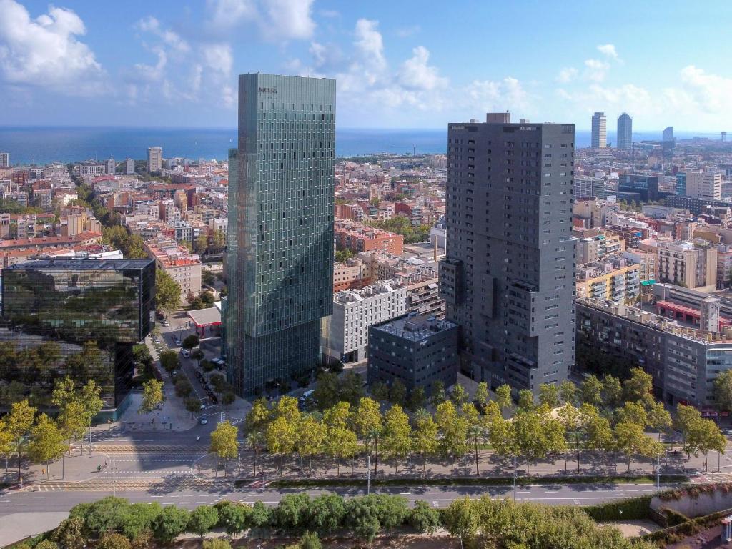 an aerial view of a city with tall buildings at The Level at Melia Barcelona Sky in Barcelona