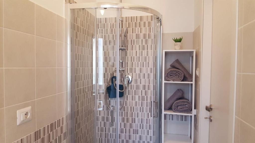 a shower in a bathroom with a glass shower at Studio apartment in the center in Lido di Ostia