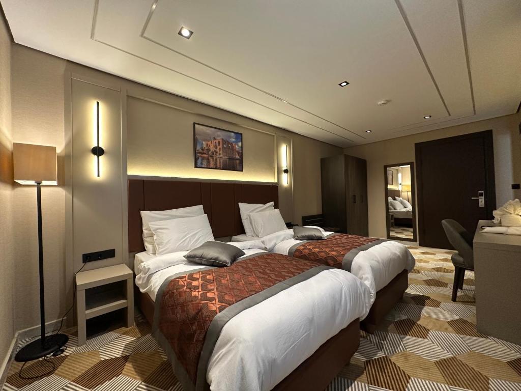 Ένα ή περισσότερα κρεβάτια σε δωμάτιο στο Venicia Hotel فندق فينيسيا