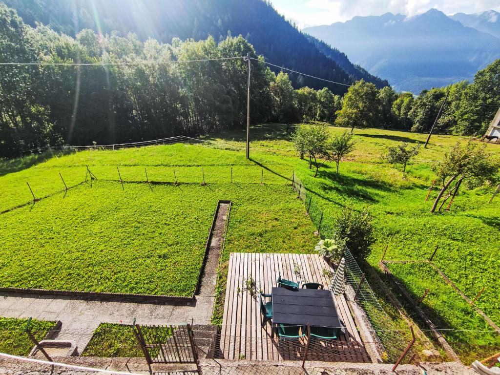 a view of a field with a picnic table at Apartment Festér by Interhome in Santi di Daone