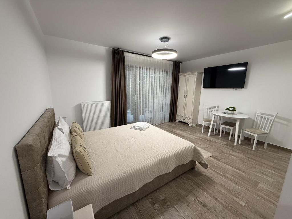 En eller flere senge i et værelse på The View Studio Busteni