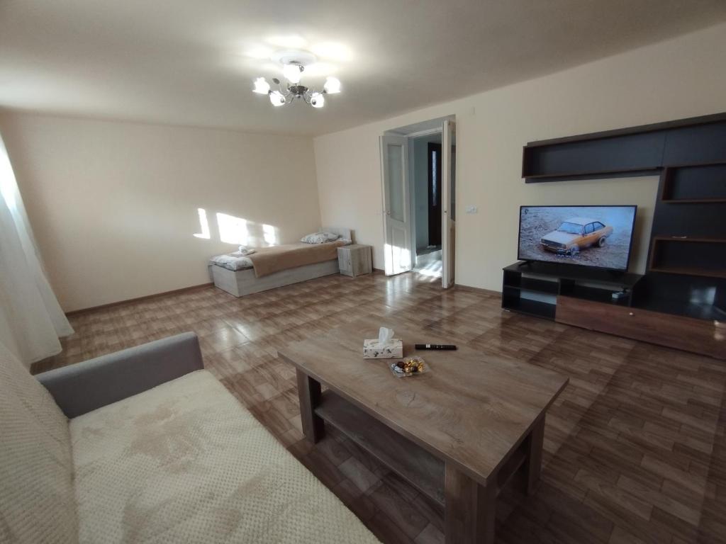 a living room with a couch and a coffee table at Guest House in Gyumri