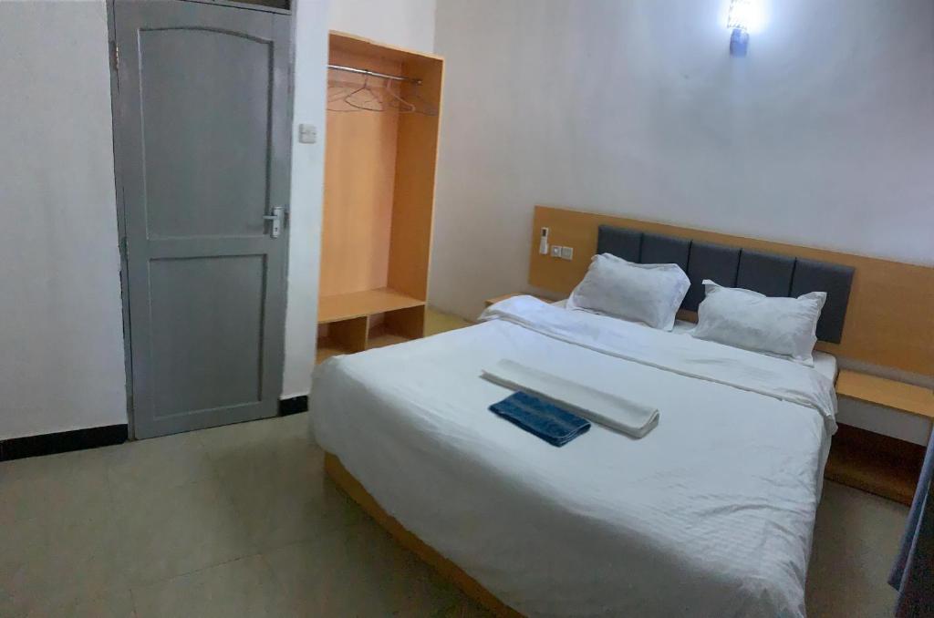 Katil atau katil-katil dalam bilik di Huasheng Hotel