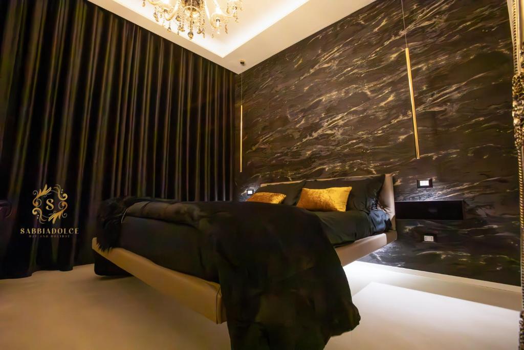 Ένα ή περισσότερα κρεβάτια σε δωμάτιο στο Sabbiadolce