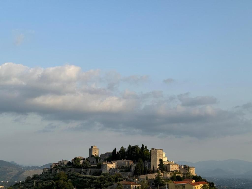 a castle on top of a hill with houses at Benesié - Villa with castle view in Monte San Giovanni Campano