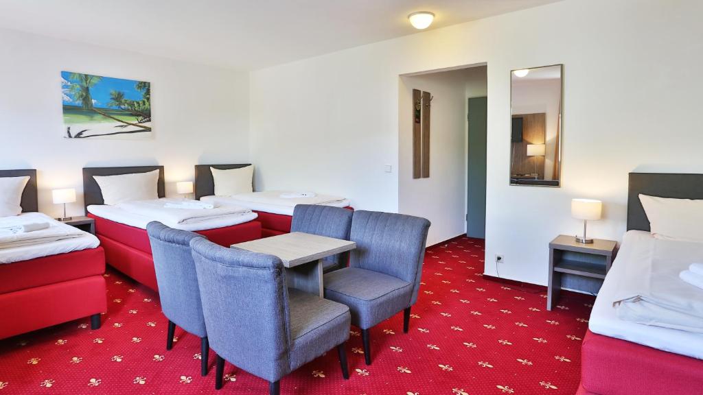Postel nebo postele na pokoji v ubytování Hotel Maurer