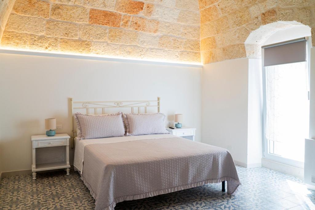 Postel nebo postele na pokoji v ubytování Dimora Donna Lucia