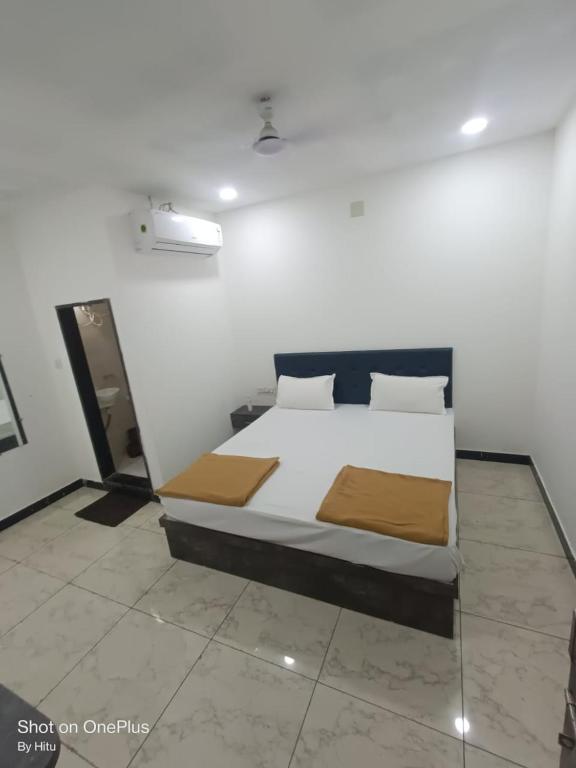 a bedroom with a large bed in a room at Kuber palace in Dwarka