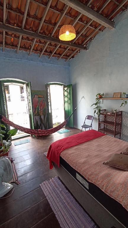 a bedroom with a hammock in a room at Pelourinho House Experience in Salvador