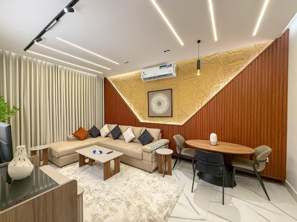 a living room with a couch and a table at The Square One in Jeddah