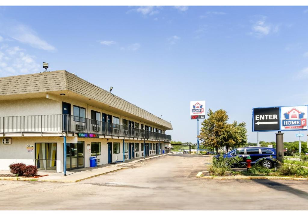 an empty street in front of a motel at Home 6 by Townhouse Topeka KS I 70 in Topeka