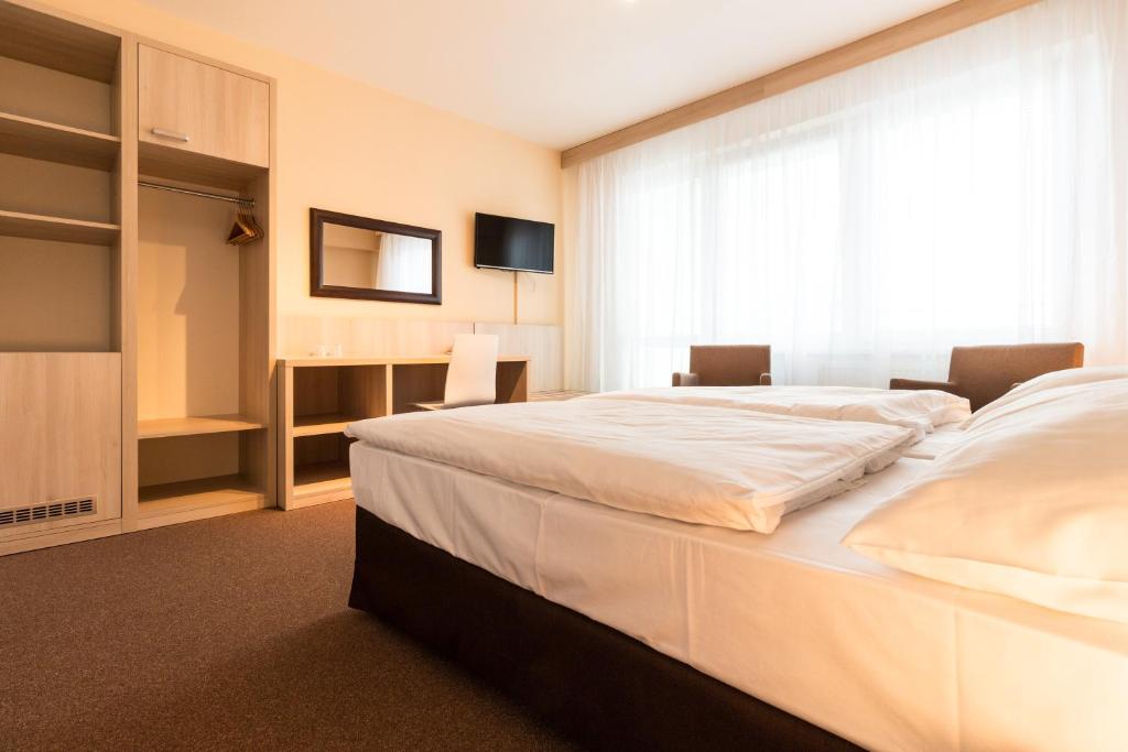 Postel nebo postele na pokoji v ubytování Hotel Krystal