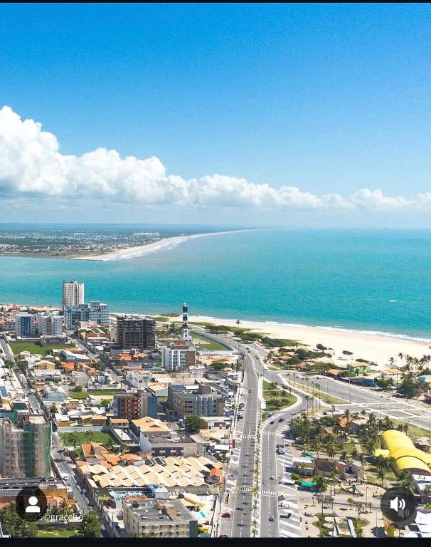 an aerial view of a city and the beach at Ap Orla de Aracaju in Aracaju