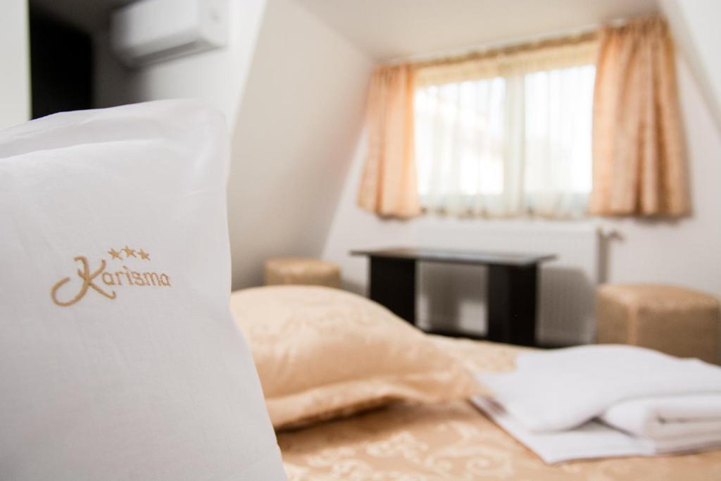 Postel nebo postele na pokoji v ubytování Hostel Karisma