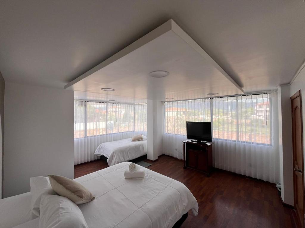 Una cama o camas en una habitación de Hesed Hospedaje