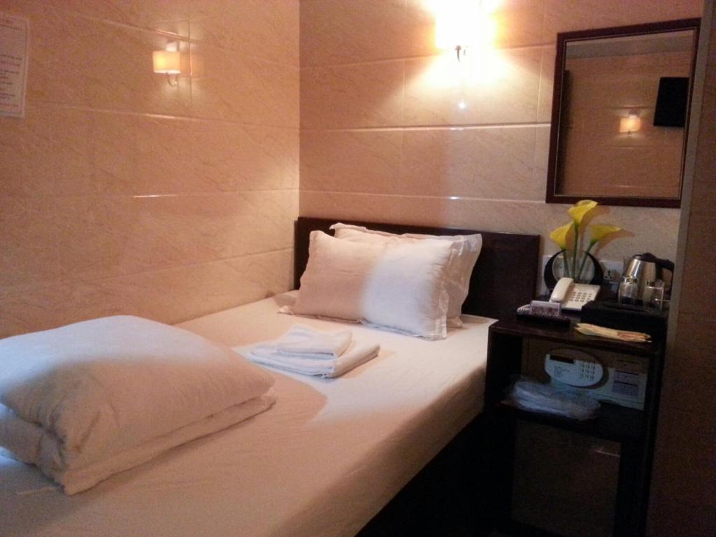 Voodi või voodid majutusasutuse Sun Guest House toas
