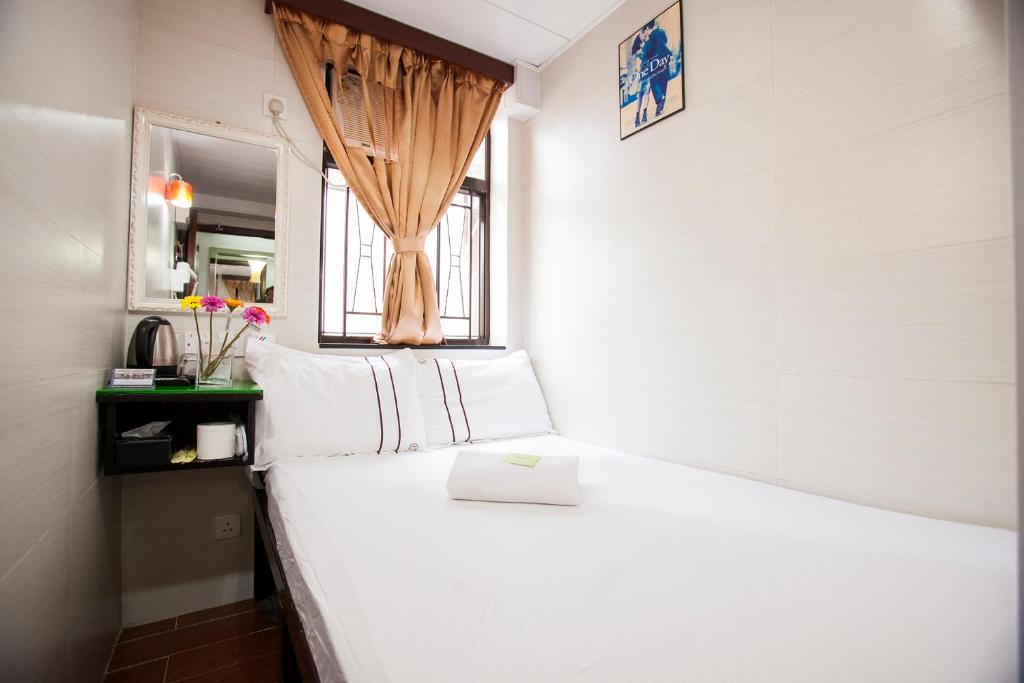 Voodi või voodid majutusasutuse Sun Guest House toas