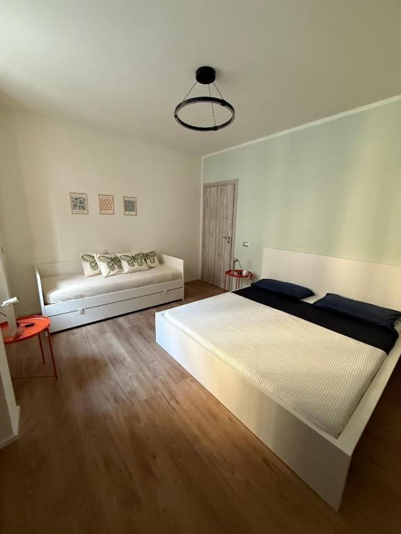 Ένα ή περισσότερα κρεβάτια σε δωμάτιο στο Casa Tuxedo-Comfort&Relax-A due passi dal centro