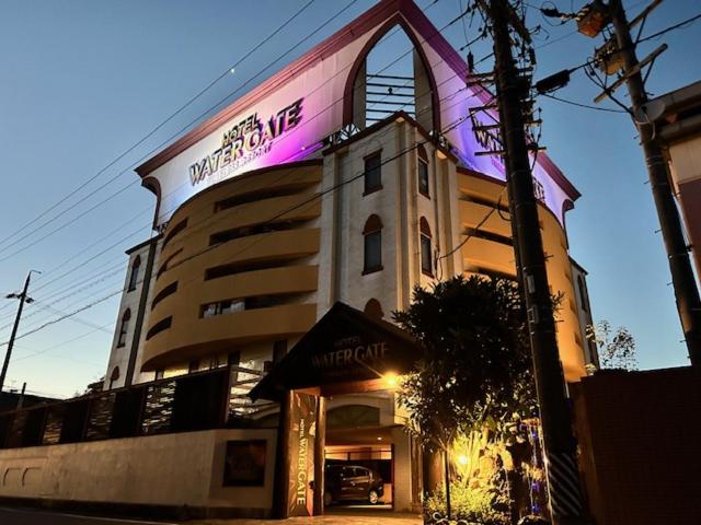 a building with a sign on the side of it at ウォーターゲート岐阜 A Japanese adult-oriented hotel in Gifu