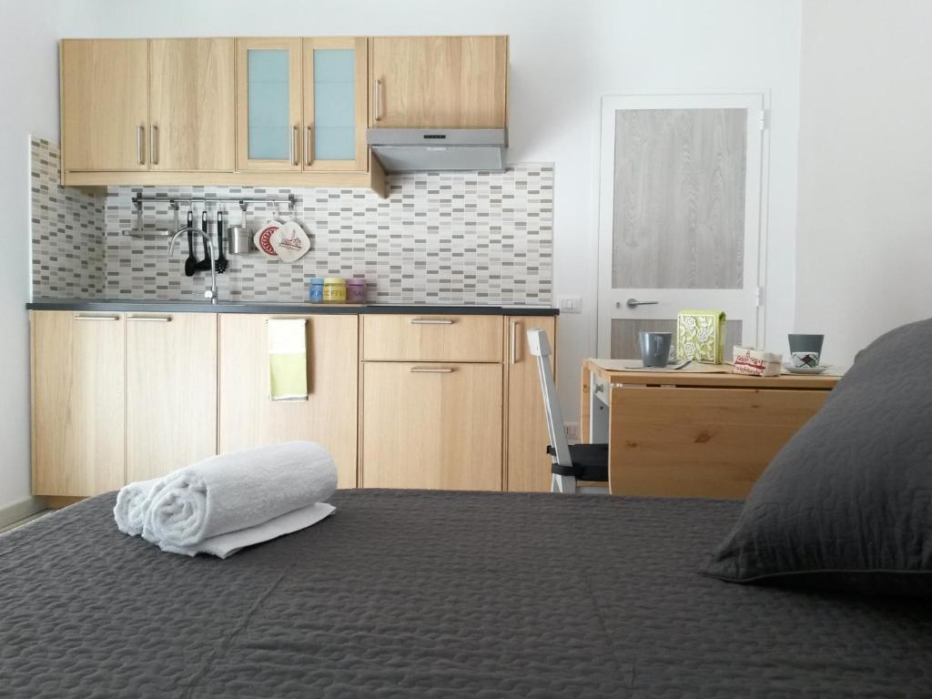 a bedroom with a bed with a white towel on it at Nonna Titta Casa Vacanze in Matera