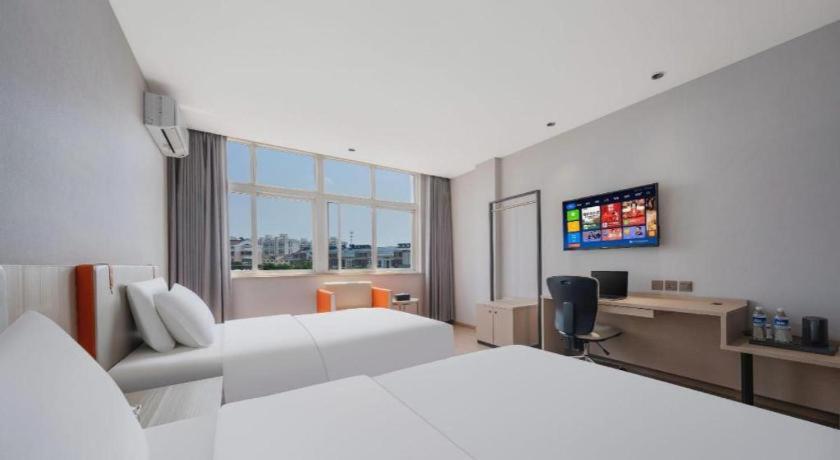 Postel nebo postele na pokoji v ubytování Jinjiang Inn Select Taizhou Jiangyan Coach Terminal