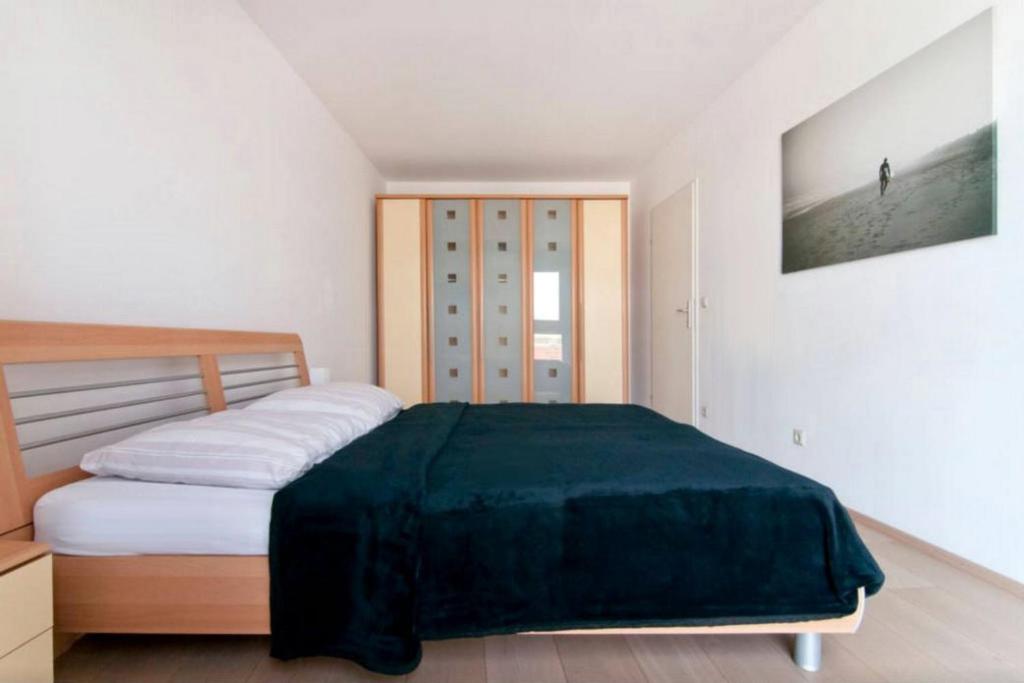 Łóżko lub łóżka w pokoju w obiekcie cosy apartment in perfect location