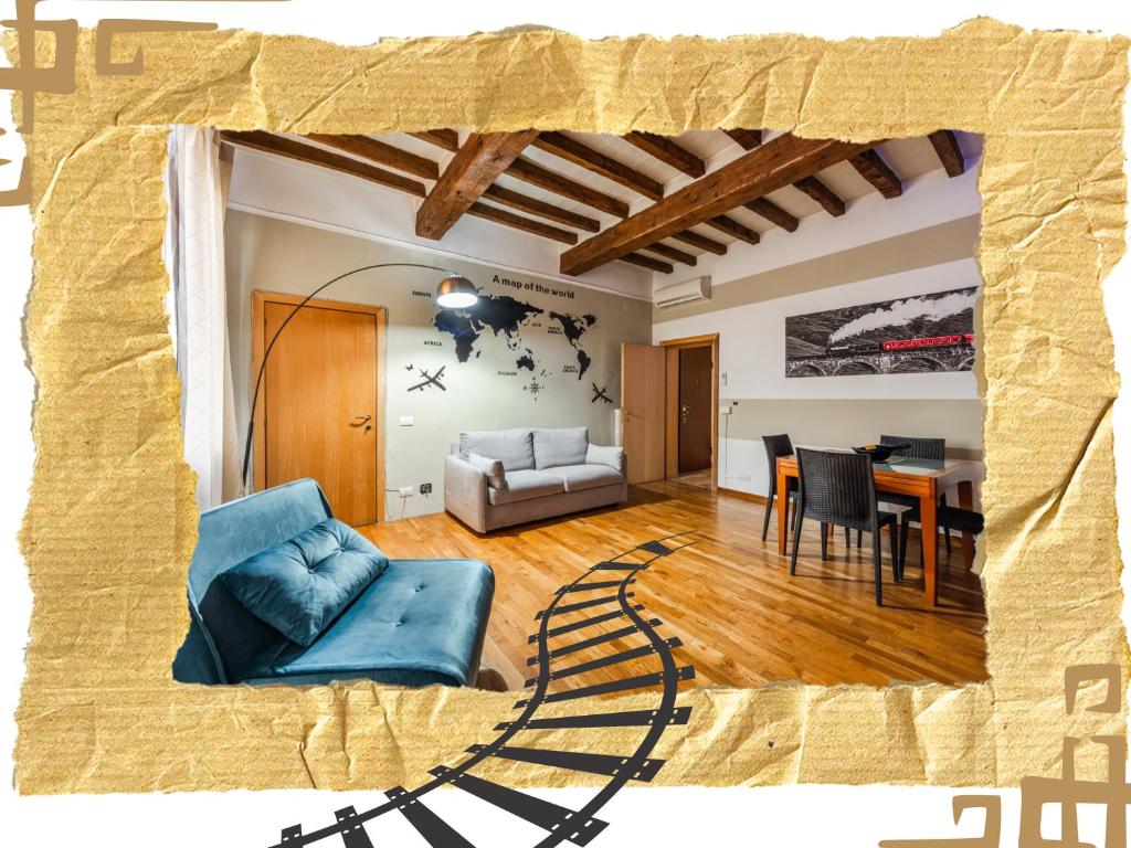 a living room with a blue couch and a table at Binario 11 - Centro, Stazione, Netflix in Modena