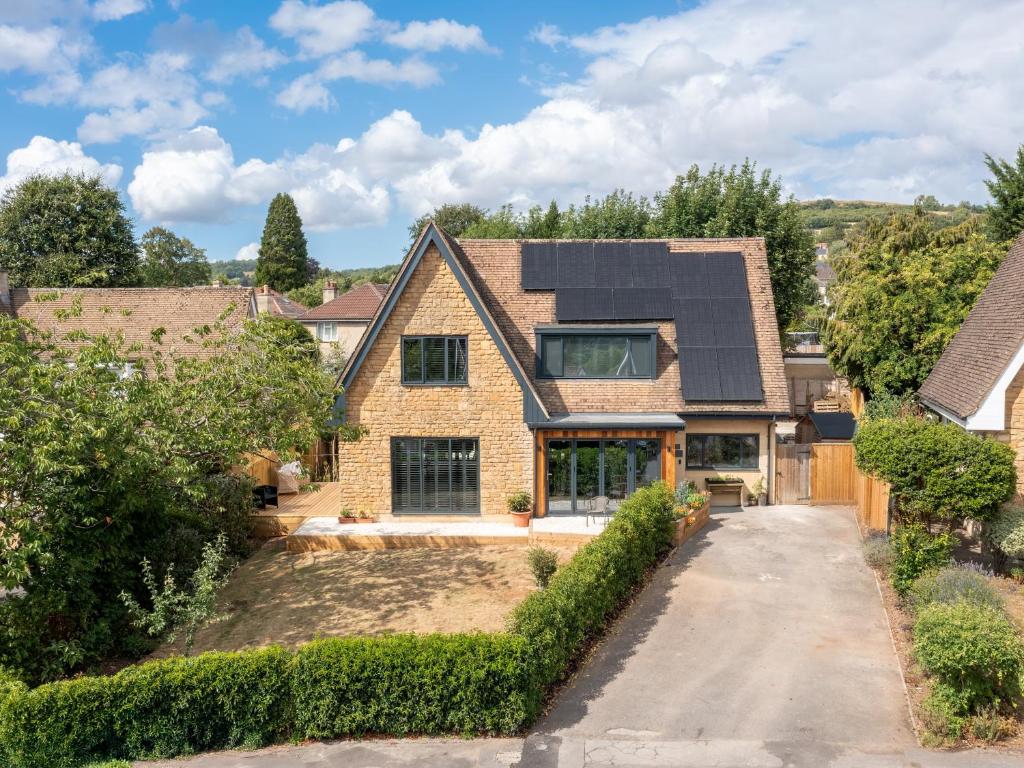 an aerial view of a house with a solar roof at Pass the Keys Stunning home with private parking in Bath in Bath
