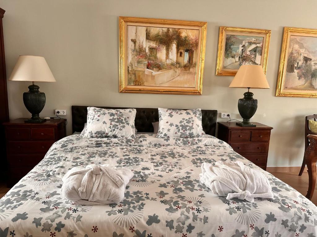 a bedroom with a bed with two towels on it at Villa IRI Habitación N 4 - Suit con balcón in Pineda de Mar