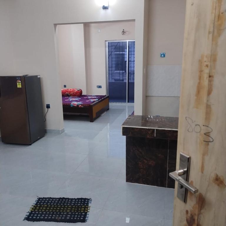 a room with a room with a bed and a door at Best Eastern, Nikunja-2 in Dhaka