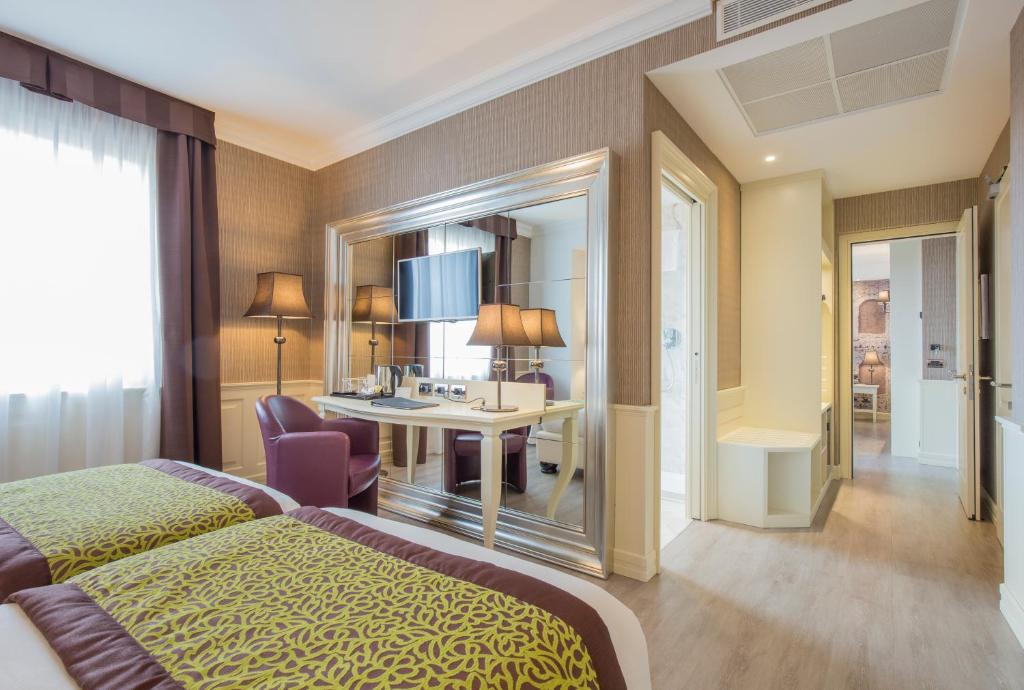 Postel nebo postele na pokoji v ubytování Hotel San Pietro