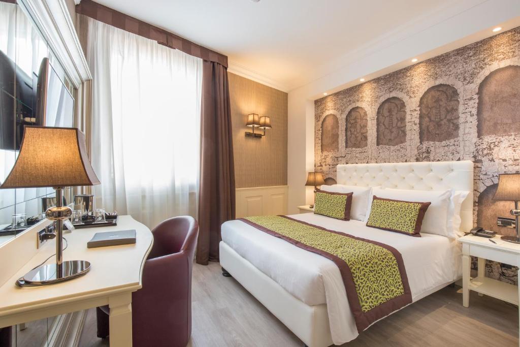 Postel nebo postele na pokoji v ubytování Hotel San Pietro