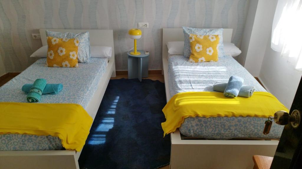 Ένα ή περισσότερα κρεβάτια σε δωμάτιο στο Casa Patines