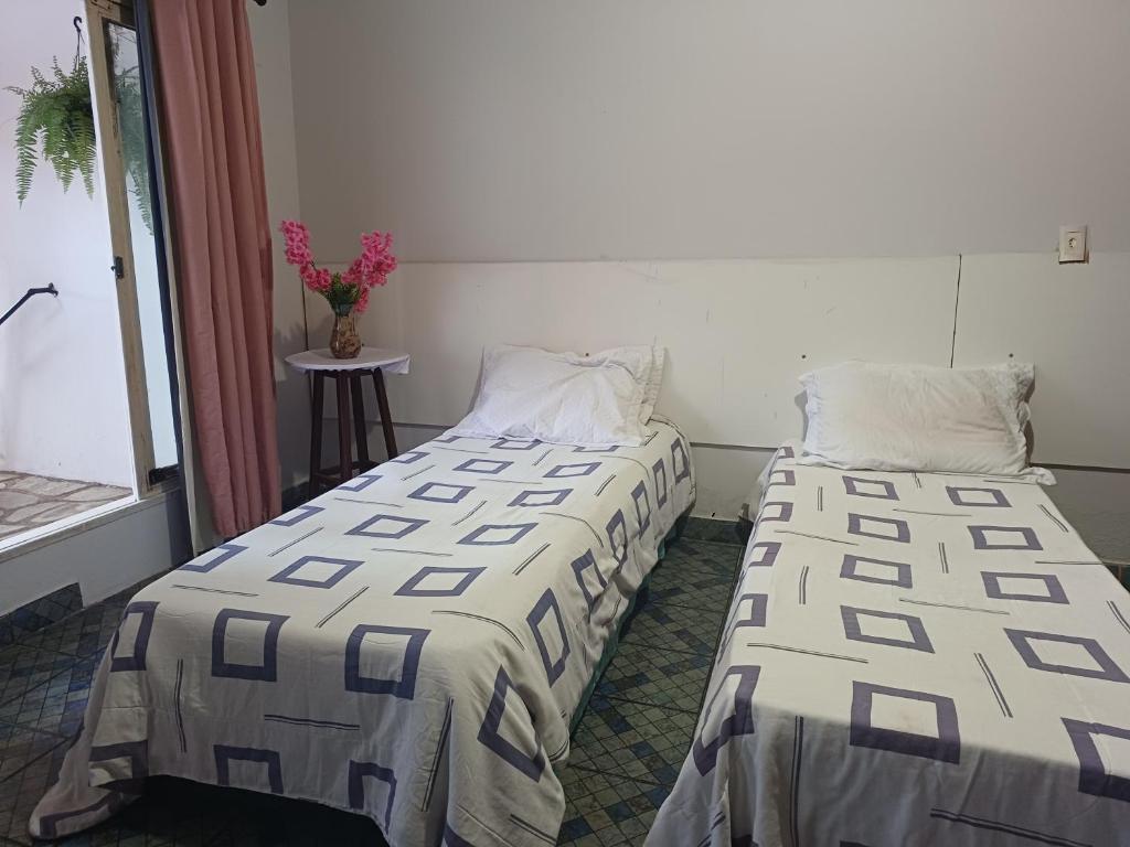 Ένα ή περισσότερα κρεβάτια σε δωμάτιο στο Hostel Goiabeiras
