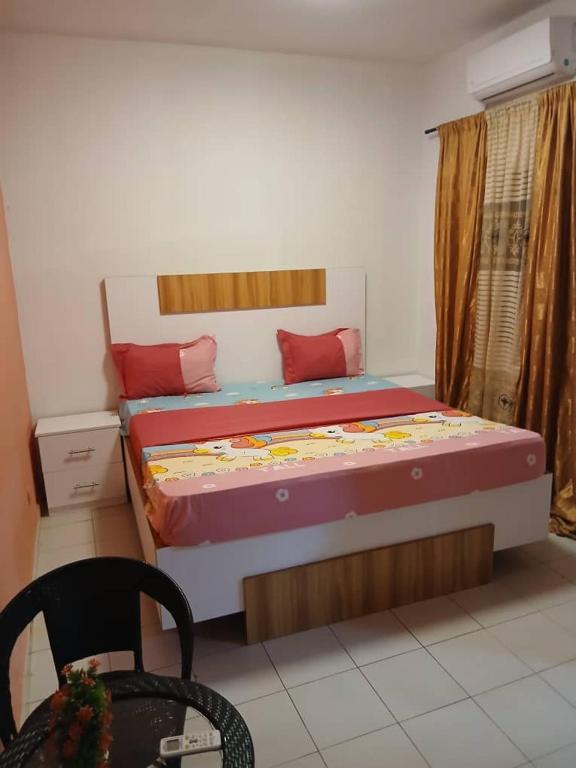 Ένα ή περισσότερα κρεβάτια σε δωμάτιο στο Baobab IMMO Thies