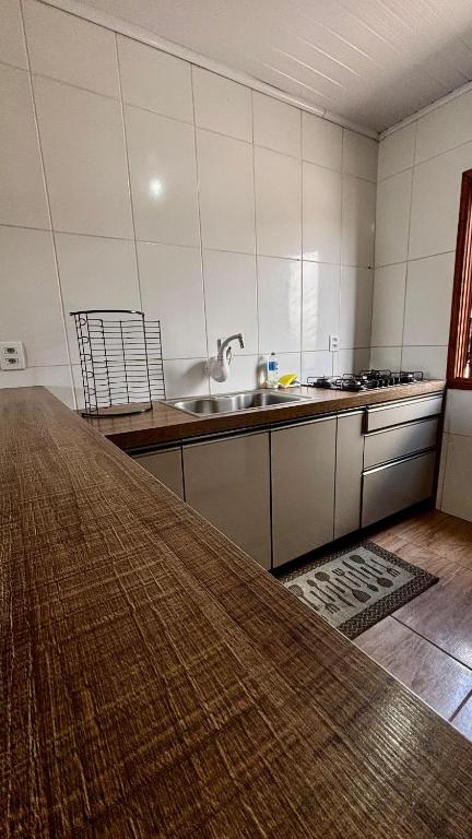 a kitchen with a counter top and a sink at Casa in Canela