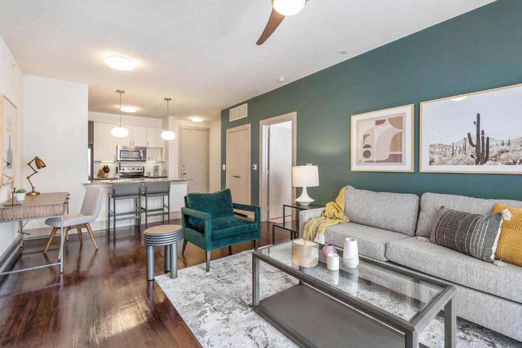 a living room with a couch and a table at Landing Apartments Austin - Lockhart in Lockhart