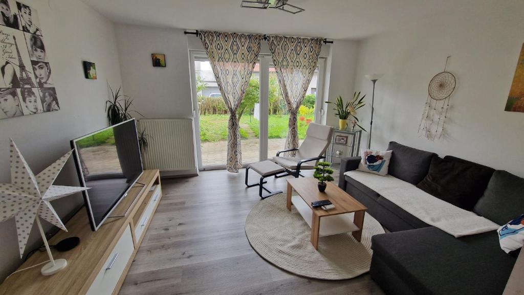 a living room with a couch and a table at Simona's place-Free private parking in Ljubljana
