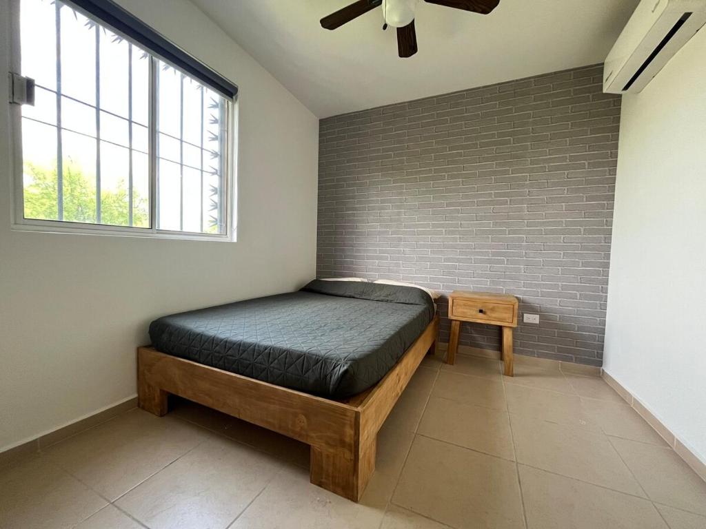 En eller flere senge i et værelse på Hermosa Casa en la Zona Industrial de Monterrey