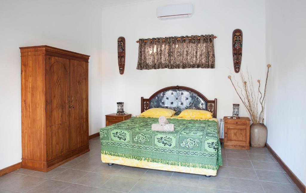 Postel nebo postele na pokoji v ubytování Yuli's Homestay
