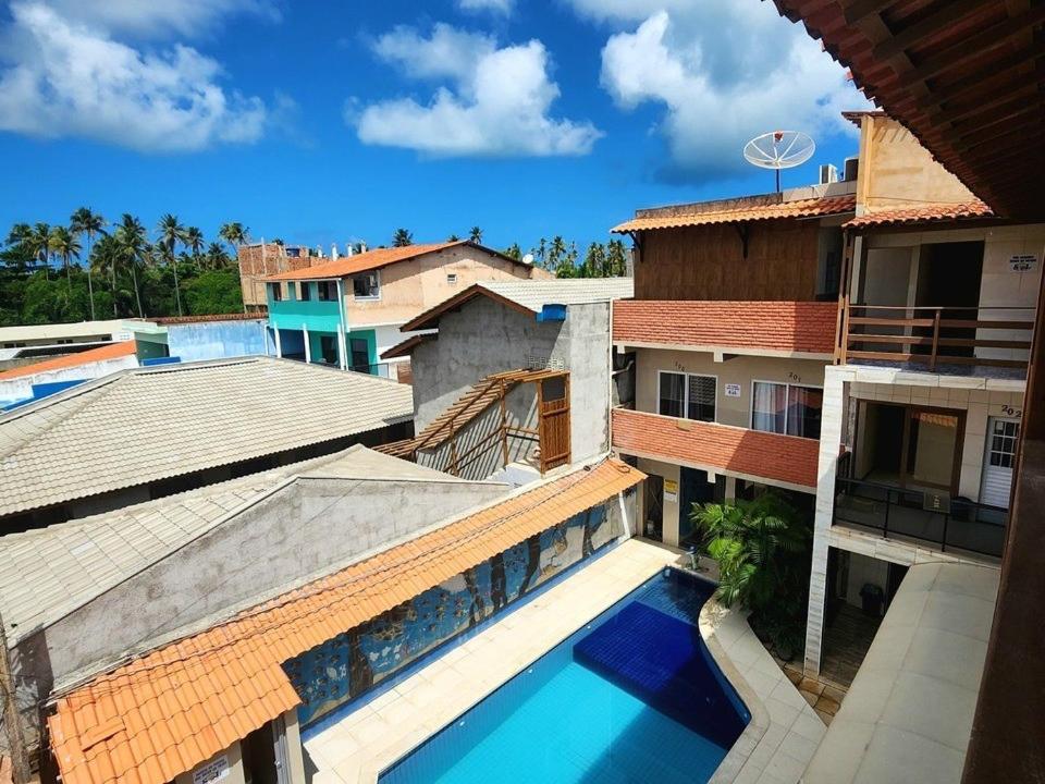 an overhead view of a building with a swimming pool at Pousada Solare in Maragogi