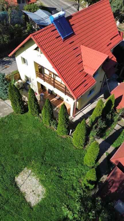an overhead view of a house with a red roof at Casa Galbena in Slănic