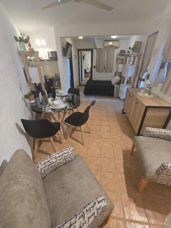 a living room with a couch and chairs and a table at Cerca de la plaza principal a estrenar in Formosa