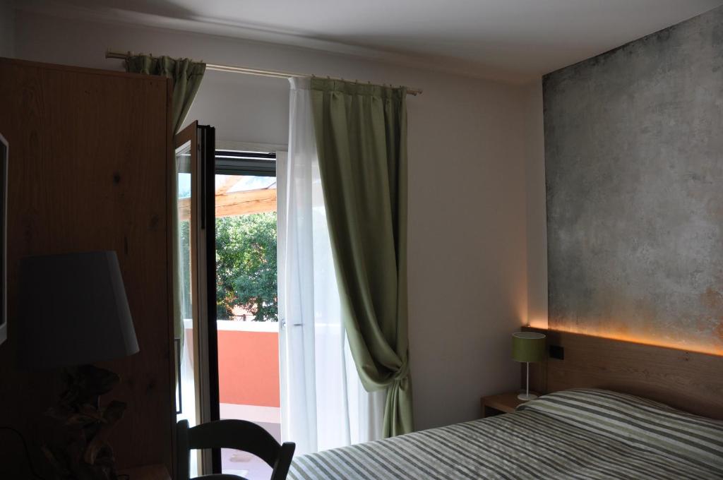 Posteľ alebo postele v izbe v ubytovaní Casa Rosanna