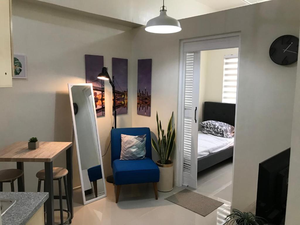 En eller flere senge i et værelse på Royal Garden Residences - Mabolo