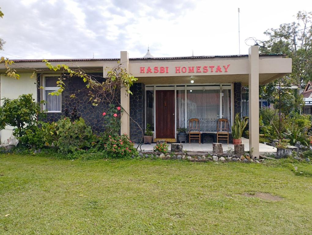a small house with a sign that reads faster honesty at Hasbi Homestay Syariah in Bukittinggi