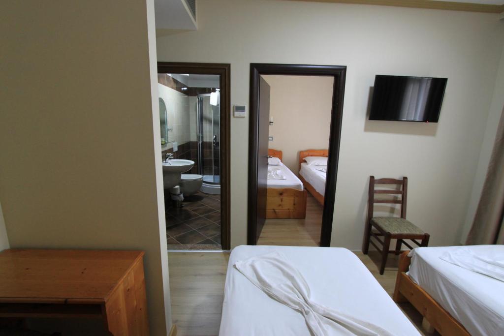Postel nebo postele na pokoji v ubytování PANORAMA Rooms Hotel near the Old Bazaar