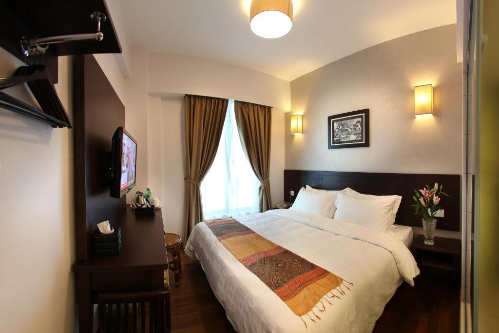 Postel nebo postele na pokoji v ubytování Hotel Richbaliz Selayang